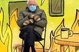 Bernie Sanders sitting in a folding chair with his arms crossed, wearing handmade, brown mittens, an army green coat, and a blue disposable mask. He’s been photoshopped into a cartoon room that is completely engulfed in flames, but has a speech bubble over his head that says “This is fine.”