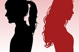 The silhouettes of two women facing away from each other. The girl on the right is red and the girl on the left is black.