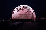 The Sphere in Las Vegas, NV with a black and white image, displaying the title card for The Wizard of Oz Sphere Experience