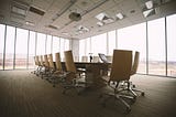 IMAGE: A large, empty corporate meeting room