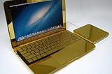 The ultimate Midas touch? The 24-carat gold MacBook Pros complete with diamond Apple logos - a snip