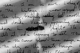 A photo of a paper with unintelligible handwritten notes on it.