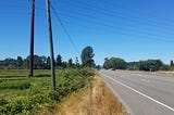 Photo of a five-lane highway next to farmland in the Puyallup River watershed. Photo credit: Puget Sound Partnership