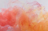 Pink and peach colour immersed in water