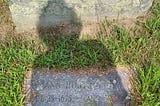 gravestone in connecticut with shadow