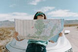 woman reading a map