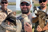 Three biologists holding ducks in their hands