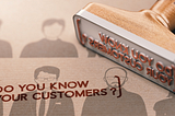 A rubber stamp that prints, “Do you know your customers?”