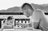 A father teaching his loving daughter