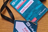 A lanyard with a UX Scotland event programme and name tag that says ‘Katie Dickerson, RNID’.