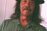 Greg Ormson, an American, one of the roughs, a kosmos.
 Borrowed from “Song of Myself,” quoted below.
 “Walt Whitman, an American, one of the roughs, a kosmos.
 Disorderly fleshy and sensual . . . eating 
 drinking and breeding.
 No sentimentalis . . . no stander above men
 and women or apart from them . . . no more modest than immodest”