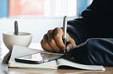 A writer writing in a diary