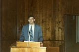 The author in 1983 standing at the pulpit of the church he pastored