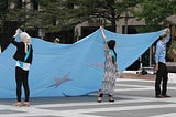 Protesters wave a East Turkestan flag