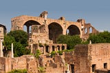 The remains of the Basilica di Massenzio, sometimes called the Basilica Nova — the last traditional Roman basilica built in Rome (note the cement coffered ceilings visible inside the large arches). Image by WikimediaImages from Pixabay