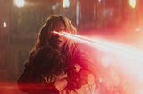 supergirl with red laser eyes
