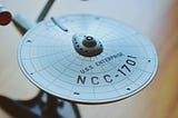 A miniature of the Star Trek starship U.S.S. Enterprise NCC — 1701.