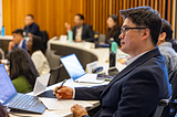 Patrick Kim in class with fellow students.