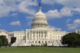 A view of the west side of the United States Capitol Building, in the afternoon.