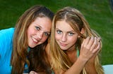 Teen girls with attitude, looking at the camera and smiling