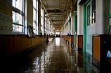 A photograph of en empty school hallway