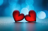 AI generated red bubble-looking hearts with blue dotted background.