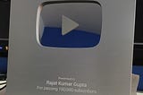 The official silver play button awarded to me Rajat Kumar Gupta for passing 100,000 subscribers on YouTube.
