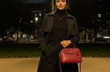 Classic black outfit elevated with statement accessories