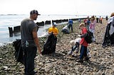 A Brooklyn Scout troop doing a beach cleanup at Floyd Bennet Field.