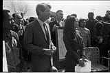 Senator Robert F. Kennedy and Dolores Huerta standing at Forty Acres, Delano, CA, 1968. Photographer: John Kouns.