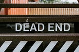 Steels steps with the words ‘DEAD END’ written across it