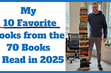 Me standing next to a stack of books that’s almost my same height (6'0")