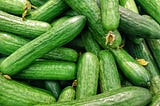 A pile of green courgettes.