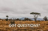 A photo of a desert scape with the words Got Questions?