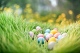 Easter eggs hinted in a grassy field