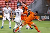 Credit: USA Today / Dynamo Theory. Picture: Matías Vera (orange, #22) fights ball with Albert Rusnak (white, #11).