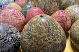 Differently coloured and exquisitely decorated traditional gourds from Peru.