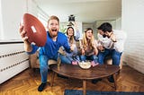 Friends watching football on TV