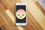A mobile with an angry face emoji