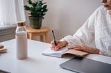 Photo of a Person Writing Article