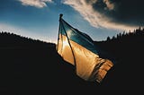 Photo of Ukrainian flag blowing in the wind, by Max Kukurudziak