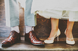 Man’s pants and shoes, and woman’s white dress and white shoes.