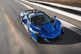 AI Image of a blue supercar. Background and road not in focus