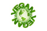 Image of the globe surrounded by leaves and the words “VEGAN” above and below