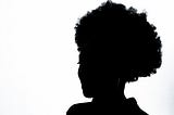 silhoutte of a black woman with an afro