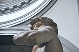 Low angle close up photograph of David sculpture in Florence, Italy