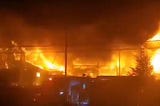 A photo of a Nova Scotia lobster facility engulfed in flames.