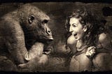 A woman laughing sitting opposite gorilla