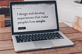 Image of a laptop with a website that reads “I design and develop experiences that make people’s lives simple.”