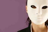 Move background with head shot of brunette lady in black shirt with white mask.